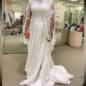 Size 10 2 piece wedding dress. It has never been altered. Only worn once.